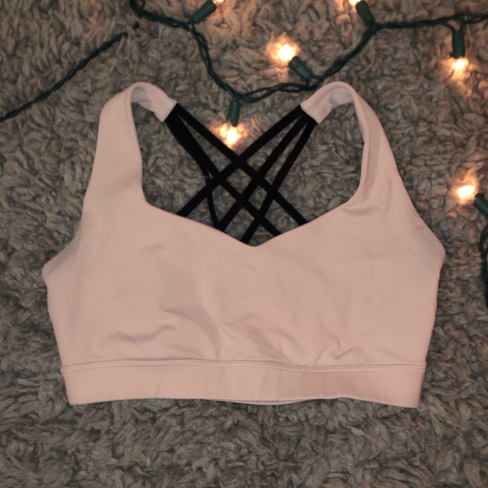 Strappy pale salmon/pink colored sports bra